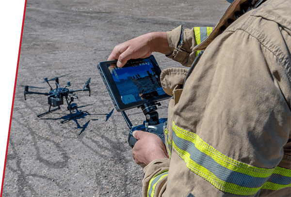 Man holding drone controller preparing to fly a drone