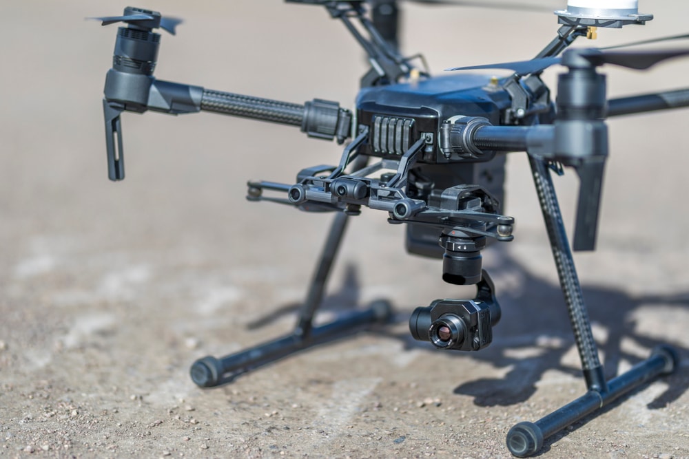 Close up of Drone on Gravel Surface with Camera